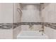 Clean bathroom with a bathtub, tile shower, and modern fixtures at 7120 E Kierland Blvd # 307, Scottsdale, AZ 85254