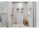 Spa-like shower with built-in shelving and a wooden bench at 7120 E Kierland Blvd # 307, Scottsdale, AZ 85254
