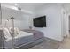 Modern bedroom with a mounted TV and cozy rug at 7120 E Kierland Blvd # 307, Scottsdale, AZ 85254