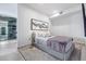 Well-lit bedroom with a comfortable bed and city views at 7120 E Kierland Blvd # 307, Scottsdale, AZ 85254