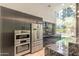 Modern community kitchen featuring stainless steel appliances at 7120 E Kierland Blvd # 307, Scottsdale, AZ 85254