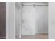 Modern hallway with a white barn door at 7120 E Kierland Blvd # 307, Scottsdale, AZ 85254