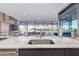 Contemporary kitchen features a large island and city views at 7120 E Kierland Blvd # 307, Scottsdale, AZ 85254