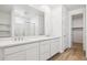 Beautiful bathroom featuring a double sink vanity, large mirror, and walk-in shower at 7396 W Whitehorn Trl, Peoria, AZ 85383