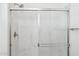 Modern shower with a sleek glass door and marble-patterned tile at 7396 W Whitehorn Trl, Peoria, AZ 85383