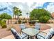Landscaped backyard with patio and seating area at 9405 E Cherrywood Dr, Sun Lakes, AZ 85248