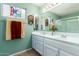 Clean bathroom with double vanity, large mirror, and shower at 9405 E Cherrywood Dr, Sun Lakes, AZ 85248