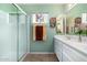 Bathroom with shower, double vanity, and updated fixtures at 9405 E Cherrywood Dr, Sun Lakes, AZ 85248