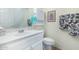 Guest bathroom with single vanity and toilet at 9405 E Cherrywood Dr, Sun Lakes, AZ 85248