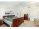 Bright bedroom featuring a king-size bed and ample closet space at 9405 E Cherrywood Dr, Sun Lakes, AZ 85248