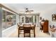 Charming dining room with a wood table and chairs, plus backyard view at 9405 E Cherrywood Dr, Sun Lakes, AZ 85248