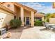 Inviting entryway with blue door and flagstone flooring at 9405 E Cherrywood Dr, Sun Lakes, AZ 85248