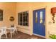 Charming entryway with white metal table and chairs at 9405 E Cherrywood Dr, Sun Lakes, AZ 85248
