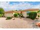 Single story home with a two car garage and nicely landscaped yard at 9405 E Cherrywood Dr, Sun Lakes, AZ 85248
