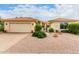 Single-story home with two-car garage and desert landscaping at 9405 E Cherrywood Dr, Sun Lakes, AZ 85248