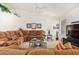 Comfortable living room featuring a brown sectional sofa and a coffee table at 9405 E Cherrywood Dr, Sun Lakes, AZ 85248
