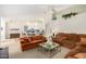 Spacious living room with comfortable seating and large windows at 9405 E Cherrywood Dr, Sun Lakes, AZ 85248