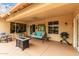Covered patio with seating area, fire pit, and grill at 9405 E Cherrywood Dr, Sun Lakes, AZ 85248