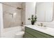 Bathroom features stylish fixtures, a modern vanity, and a tub-shower combination with tiled walls at 135 E Julian Dr, Gilbert, AZ 85295