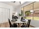 Cozy breakfast nook with backyard view featuring a round marble table with seating for four at 135 E Julian Dr, Gilbert, AZ 85295