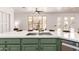 Close up on the kitchen island and sink, with a view of the backyard dining area at 135 E Julian Dr, Gilbert, AZ 85295