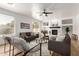 Comfortable living room with a fireplace, built-in shelves, and cozy seating arrangement at 135 E Julian Dr, Gilbert, AZ 85295