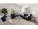 Cozy living room with plush seating, stylish decor, and a large window providing natural light at 135 E Julian Dr, Gilbert, AZ 85295