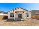 View of the backyard featuring a covered patio and a blank canvas for your personalized landscaping and outdoor living at 16580 N Dante Way, Maricopa, AZ 85138