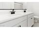 Bathroom with double sink vanity and black hardware at 16580 N Dante Way, Maricopa, AZ 85138