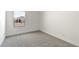 Empty bedroom with carpet flooring and a window at 16580 N Dante Way, Maricopa, AZ 85138