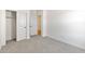 Empty bedroom with carpet flooring and closet at 16580 N Dante Way, Maricopa, AZ 85138