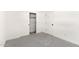 Empty bedroom with carpet flooring and closet at 16580 N Dante Way, Maricopa, AZ 85138