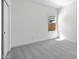Empty bedroom with carpet flooring and a window at 16580 N Dante Way, Maricopa, AZ 85138