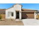 Inviting single-story home featuring a private entryway, a two car garage and low maintenance landscaping at 16580 N Dante Way, Maricopa, AZ 85138