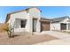 Attractive one-story home boasting a 2-car garage, simple landscaping and a private entrance at 16580 N Dante Way, Maricopa, AZ 85138