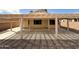 Spacious covered patio in the backyard, perfect for outdoor relaxation and entertaining at 18068 W Browning Dr, Surprise, AZ 85374