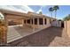 Backyard patio with shaded pergola and privacy fencing, creating a private and inviting outdoor space at 18068 W Browning Dr, Surprise, AZ 85374