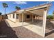 Charming backyard patio with a louvered roof, providing shade and a tranquil outdoor space at 18068 W Browning Dr, Surprise, AZ 85374