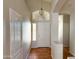 Bright entryway with tile flooring, decorative lighting, and a neutral color palette at 18068 W Browning Dr, Surprise, AZ 85374
