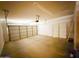Spacious two-car garage with attached storage and an automatic door at 18068 W Browning Dr, Surprise, AZ 85374