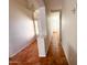 Hallway boasts tile flooring and natural light streaming in from the entrance at 18068 W Browning Dr, Surprise, AZ 85374