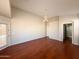A spacious living room boasts lots of natural light, ceiling fan, and access to the backyard at 18068 W Browning Dr, Surprise, AZ 85374
