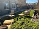 Backyard with patio, artificial grass, string lights, and desert landscaping at 2738 E Cherry Hill E Dr, Gilbert, AZ 85298