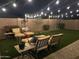 Landscaped backyard with patio furniture and string lights at 2738 E Cherry Hill E Dr, Gilbert, AZ 85298