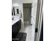 Clean bathroom with dark vanity and bathtub shower combo at 2738 E Cherry Hill E Dr, Gilbert, AZ 85298