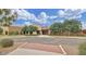 Beige single story building with brick facade, professional landscaping, and parking at 2738 E Cherry Hill E Dr, Gilbert, AZ 85298