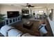 Spacious living room with dark floors, comfortable leather seating, and an entertainment center at 2738 E Cherry Hill E Dr, Gilbert, AZ 85298