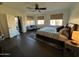 Bright main bedroom with wood floors, ceiling fan, and natural light at 2738 E Cherry Hill E Dr, Gilbert, AZ 85298