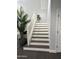 Elegant staircase with white railings and dark wood steps at 2738 E Cherry Hill E Dr, Gilbert, AZ 85298
