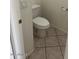 Small half bathroom with toilet and tile floor at 4051 W Buckskin Trl, Phoenix, AZ 85083